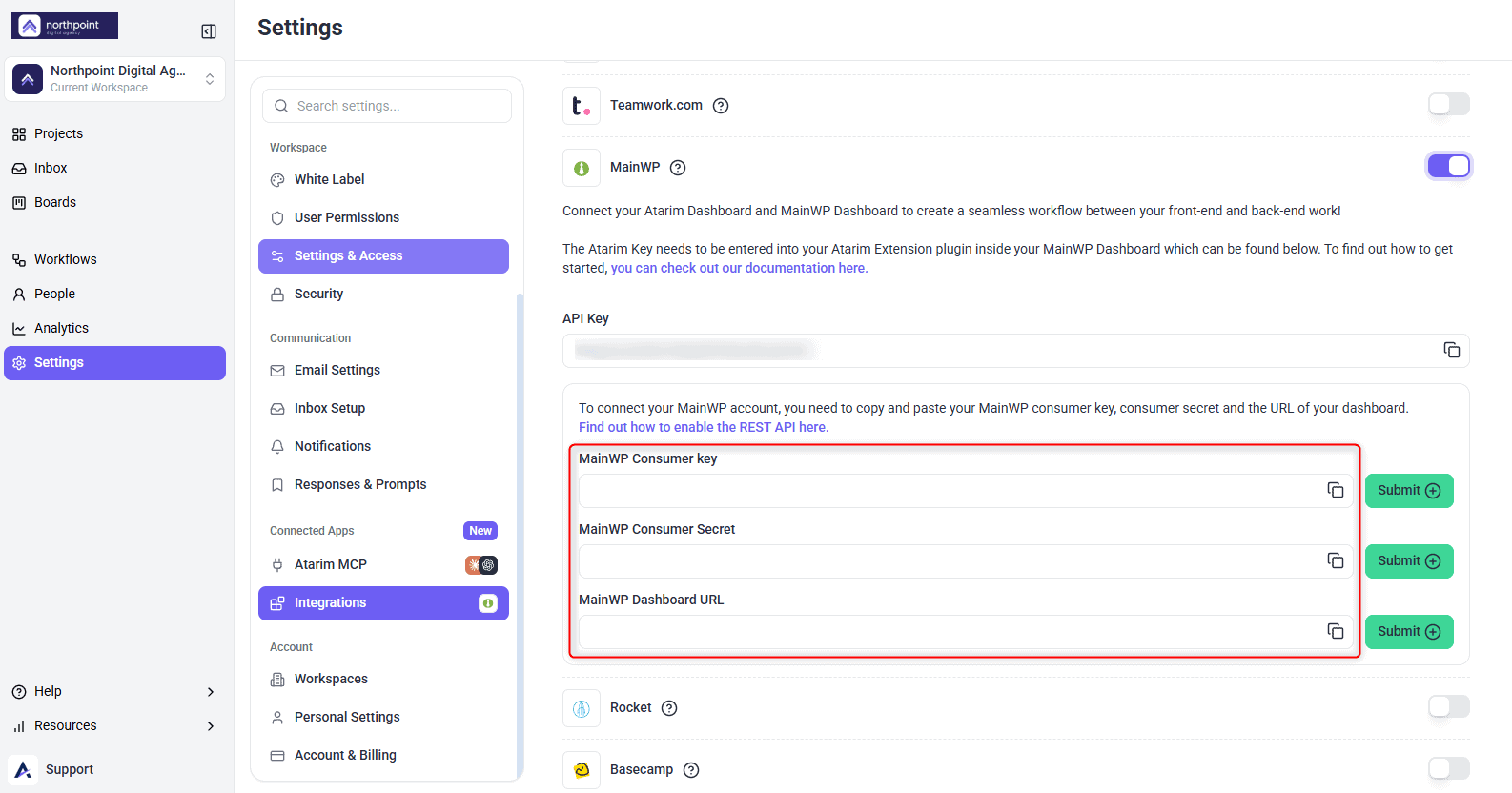 The MainWP row switched on, with the API Key field and the MainWP Consumer key, Consumer Secret and Dashboard URL fields